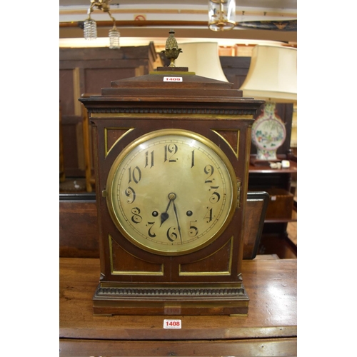 1409 - A late 19th century mahogany and brass bracket type clock, with 8in silvered circular dial, str... 