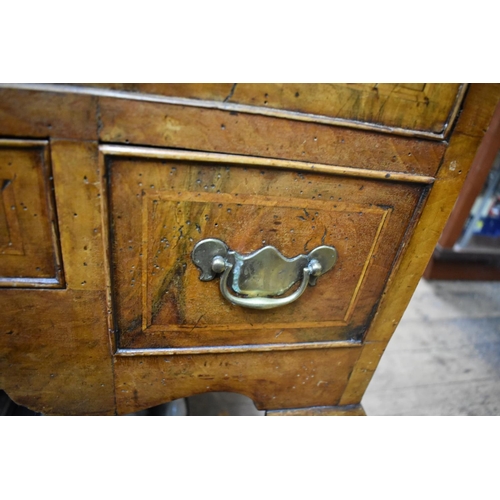 1410 - An 18th century walnut and crossbanded lowboy, on cabriole legs, 77cm wide. ... 