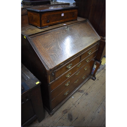 1420 - An 18th century oak bureau, 91cm wide.