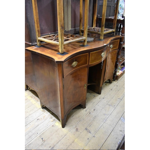 1421 - A George III mahogany and satinwood crossbanded serpentine fronted pedestal sideboard, 139.5cm wide.... 