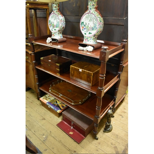 1425 - A large Victorian mahogany three tier whatnot, on brass castors, 121.5cm wide.