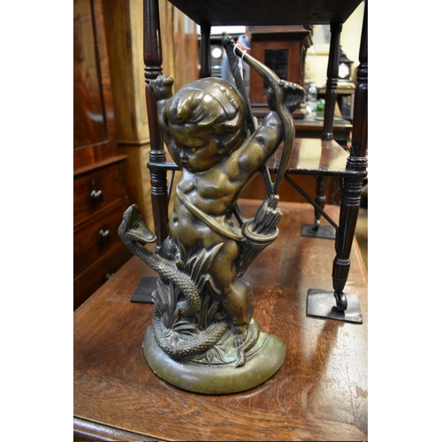 1434 - A Victorian bronze cherub and serpent doorstop, 38.5cm high.