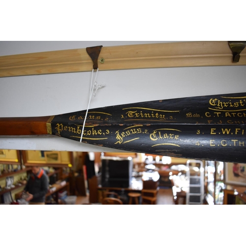 1445 - Two Victorian Cambridge University rowing oars, by E Norris, the blade of each variously inscribed a... 