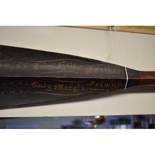 1445 - Two Victorian Cambridge University rowing oars, by E Norris, the blade of each variously inscribed a... 