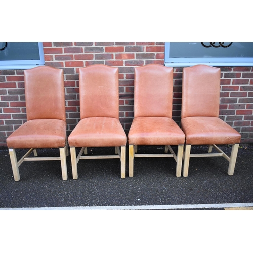 1456 - A set of four contemporary tan leather dining chairs. 