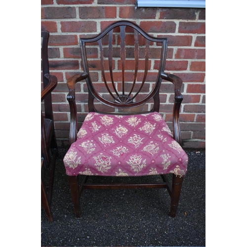 1459 - Two George III mahogany elbow dining chairs. 