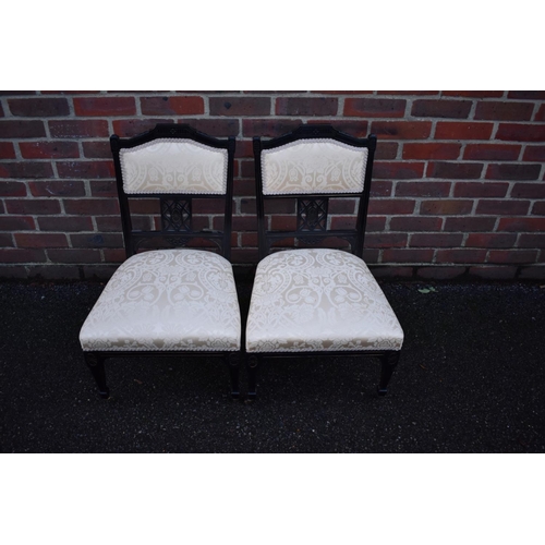 1464 - A pair of late Victorian ebonized salon occasional chairs.