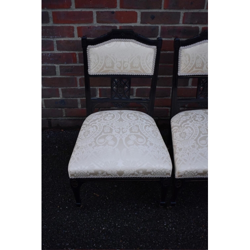 1464 - A pair of late Victorian ebonized salon occasional chairs.