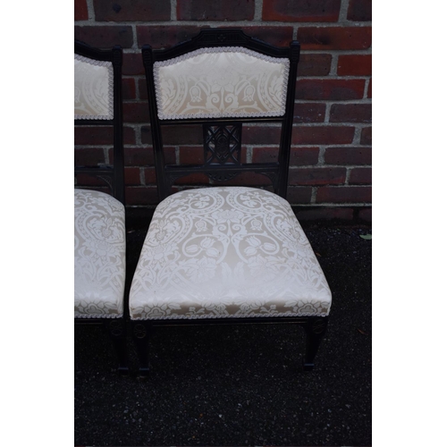 1464 - A pair of late Victorian ebonized salon occasional chairs.