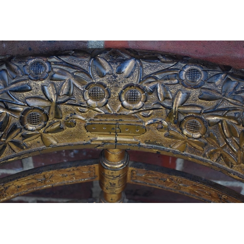 1465 - A 19th century giltwood corner chair, with heavily carved back rail.