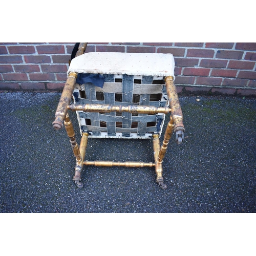 1465 - A 19th century giltwood corner chair, with heavily carved back rail.