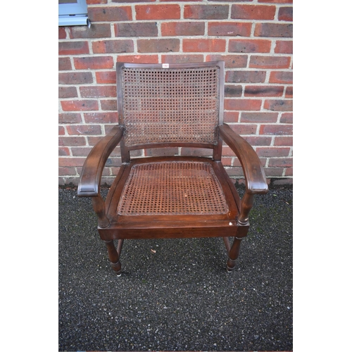 1467 - A Colonial teak and cane planter's chair.