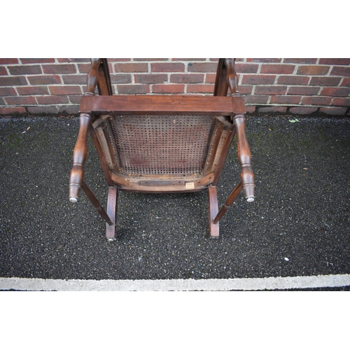 1467 - A Colonial teak and cane planter's chair.