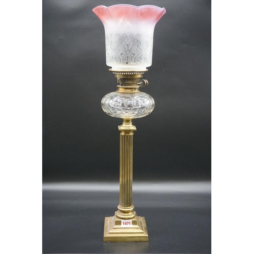 1471 - An antique brass oil lamp, with etched and cranberry stained shade, height including shade 65cm.... 