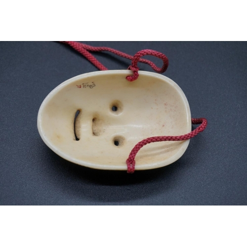 1245 - A good Japanese carved ivory Noh mask okimono of Fukai, Edo, signed, 7.2cm.