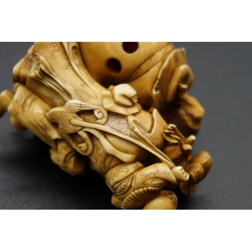 1247 - A good and large Japanese carved ivory netsuke figure group, 19th century, depicting a man, woman an... 