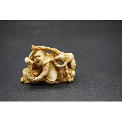 1249 - A good Japanese carved ivory netsuke, 19th century, depicting a man with a rat, signed, 4.6cm wide.... 