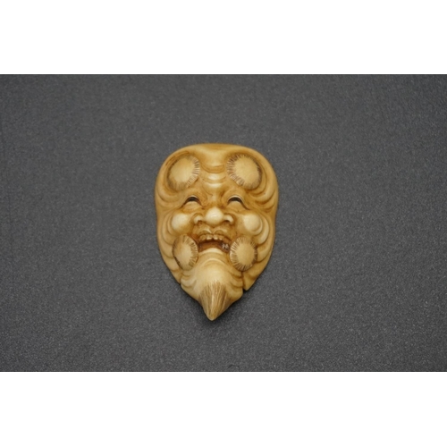 1266 - A good Japanese carved ivory 'Jyo-kei' Noh mask netsuke, Meiji, signed, 4cm.