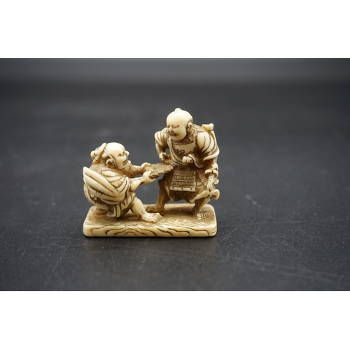 1270 - A good Japanese carved walrus ivory netsuke, Edo, depicting two Samurai, 4.7cm wide.... 