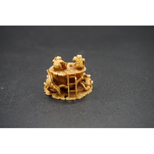 1273 - A carved Japanese ivory netsuke, by Gyokuzan, Edo, depicting toads on a lily pad, signed, 3.6cm wide... 