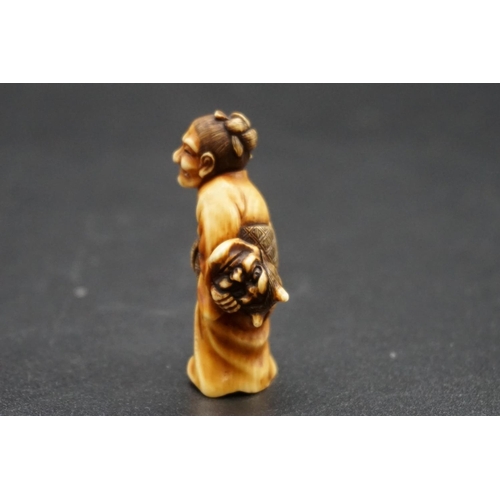 1278 - A good Japanese carved ivory netsuke, Meiji, depicting an elderly lady with a Noh mask and stick, 4.... 