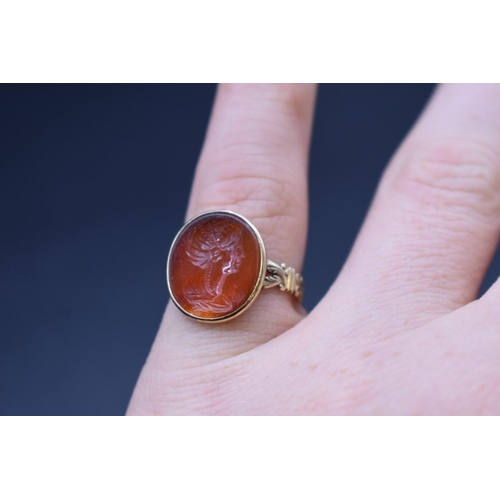 202 - An interesting antique yellow metal and carnelian intaglio ring, the intaglio possibly Roman, finely... 