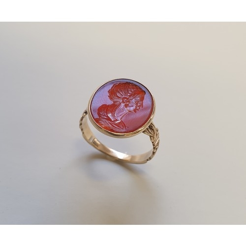 202 - An interesting antique yellow metal and carnelian intaglio ring, the intaglio possibly Roman, finely...