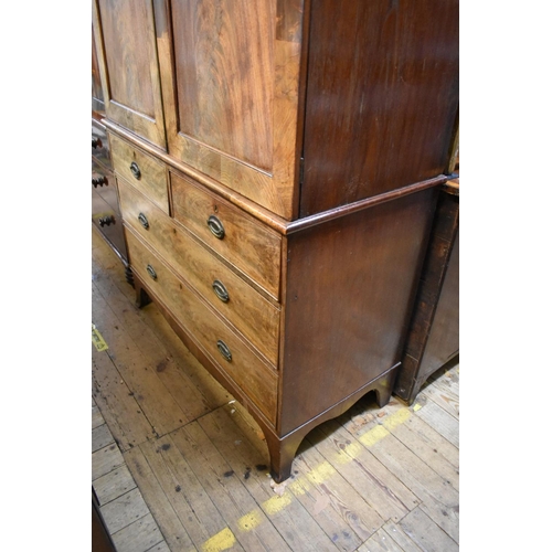 1435 - A George III figured mahogany linen press, the pair of panelled doors now enclosing hanging space, 1... 