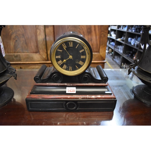 1439 - A late 19th century French slate and red marble drumhead clock, 24.5cm high, with pendulum.... 