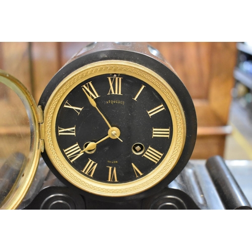 1439 - A late 19th century French slate and red marble drumhead clock, 24.5cm high, with pendulum.... 