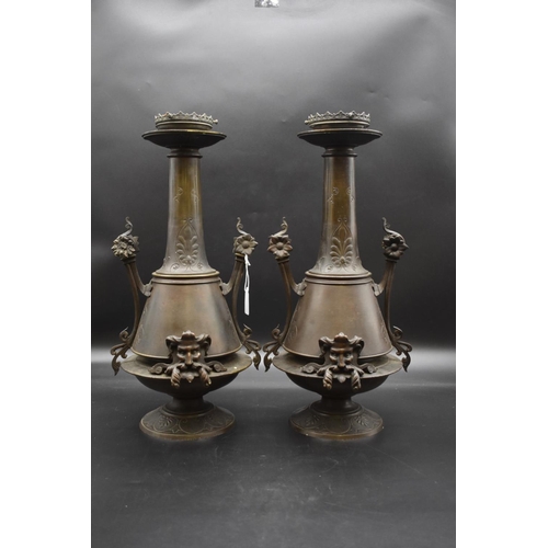 1440 - A large pair of French bronze twin handled table lamps, in the Aesthetic style, 48cm high. ... 