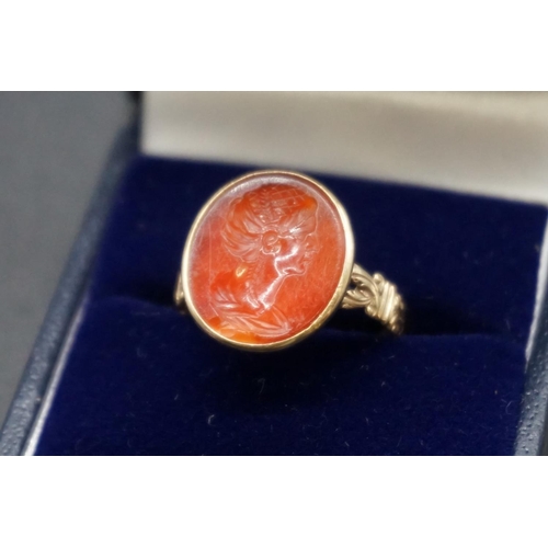 202 - An interesting antique yellow metal and carnelian intaglio ring, the intaglio possibly Roman, finely... 