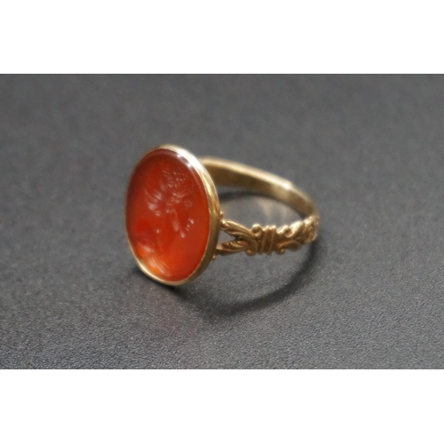 202 - An interesting antique yellow metal and carnelian intaglio ring, the intaglio possibly Roman, finely... 