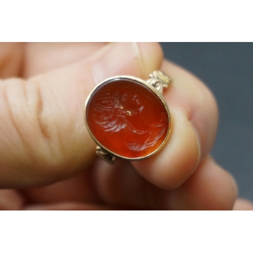 202 - An interesting antique yellow metal and carnelian intaglio ring, the intaglio possibly Roman, finely... 