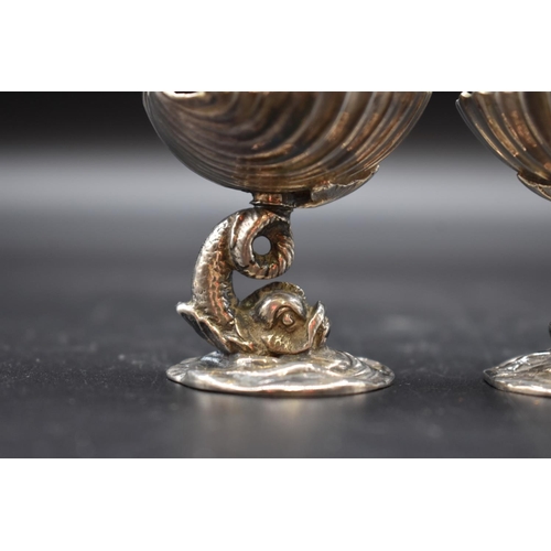 28 - A pair of silver novelty dolphin and shell salts, by Richard Lawton Ltd, London 1988, 5cm ... 