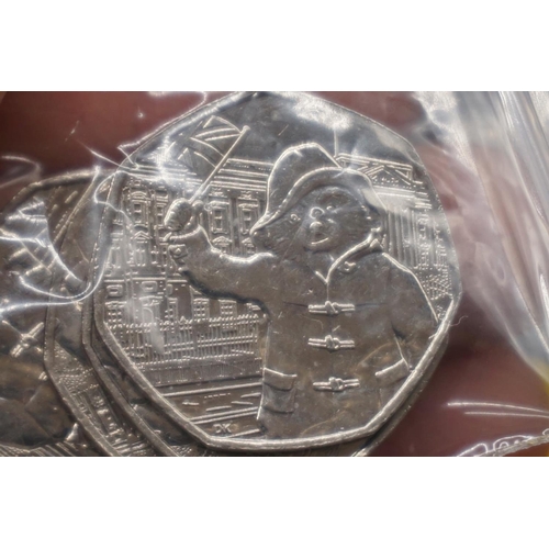 411 - Coins: Royal Mint, Paddington Bear 2018 collectable circulated fifty pence coins, comprising: thirty... 