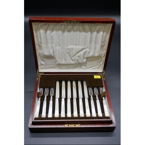 64 - A mahogany cased set of twelve pairs of silver and mother-of-pearl dessert knives and forks, by Mapp... 