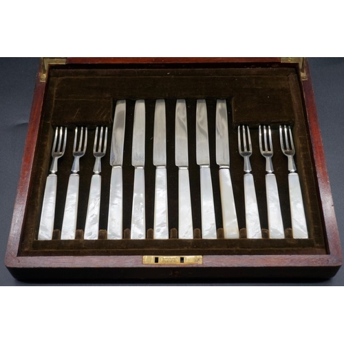 64 - A mahogany cased set of twelve pairs of silver and mother-of-pearl dessert knives and forks, by Mapp... 