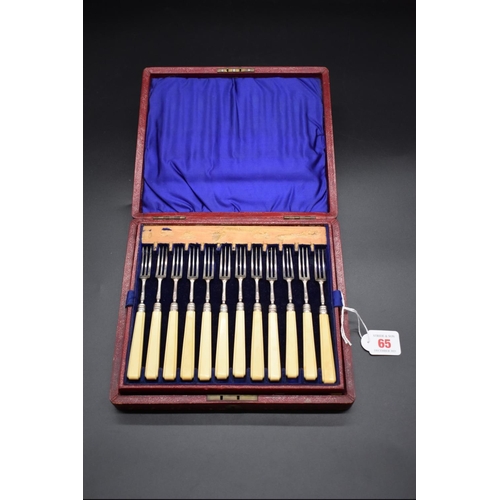 65 - A cased set of twelve pairs of William IV silver and ivory handled dessert knives and forks, no make... 