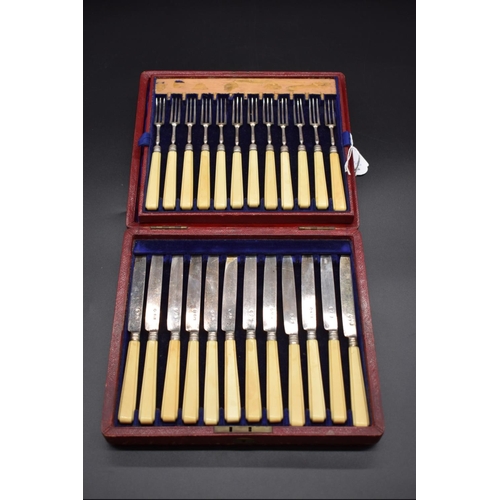 65 - A cased set of twelve pairs of William IV silver and ivory handled dessert knives and forks, no make... 