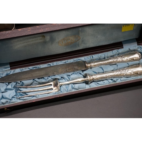 76 - A cased pair of French silver fish servers; together with a collection of French silver plated cutle... 