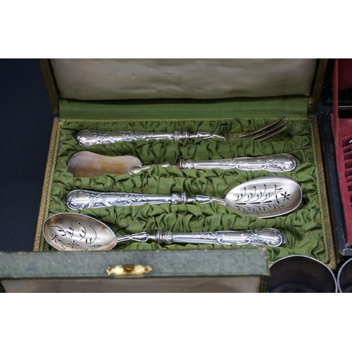 76 - A cased pair of French silver fish servers; together with a collection of French silver plated cutle... 