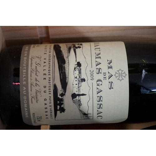 142 - Three 75cl bottles of Mas de Daumas Gassac, 2009, in owc.Professionally stored since purchased in en... 