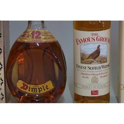 147 - Two bottles of blended whisky, comprising: a 75cl Dimple 12 year old; and a 70cl The Famous Grouse, ... 