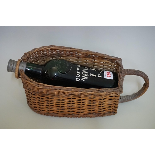 154 - An old bottle of Quinta do Noval LB port, believed 1951 or 1953, in wicker stand.