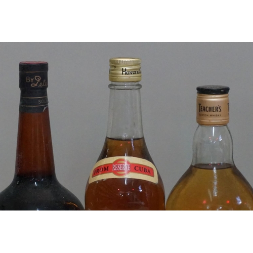 155 - A 70cl bottle of Teacher's blended whisky; together with a 75cl bottle of Havana Club; a 35cl bottle... 