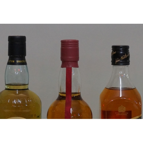 63 - Three 70cl bottles of blended whisky, comprising: Johnnie Walker 'Black label'; Immortal Memory; and... 