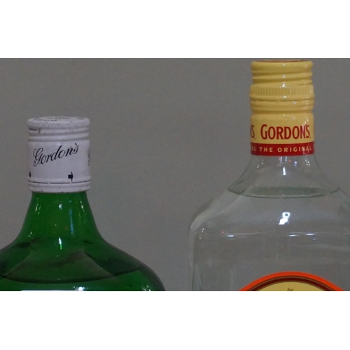 96 - An old 1.13 litre bottle of Gordon's London dry gin; together with another 1 litre bottle of Gordon'... 