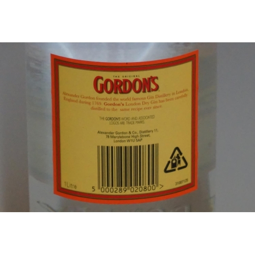 96 - An old 1.13 litre bottle of Gordon's London dry gin; together with another 1 litre bottle of Gordon'... 