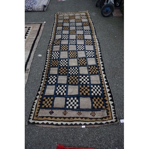 1063 - A Persian Gabbeh runner, 330cm x 110cm; together with a Gabbeh long rug, 232cm x 130cm.... 